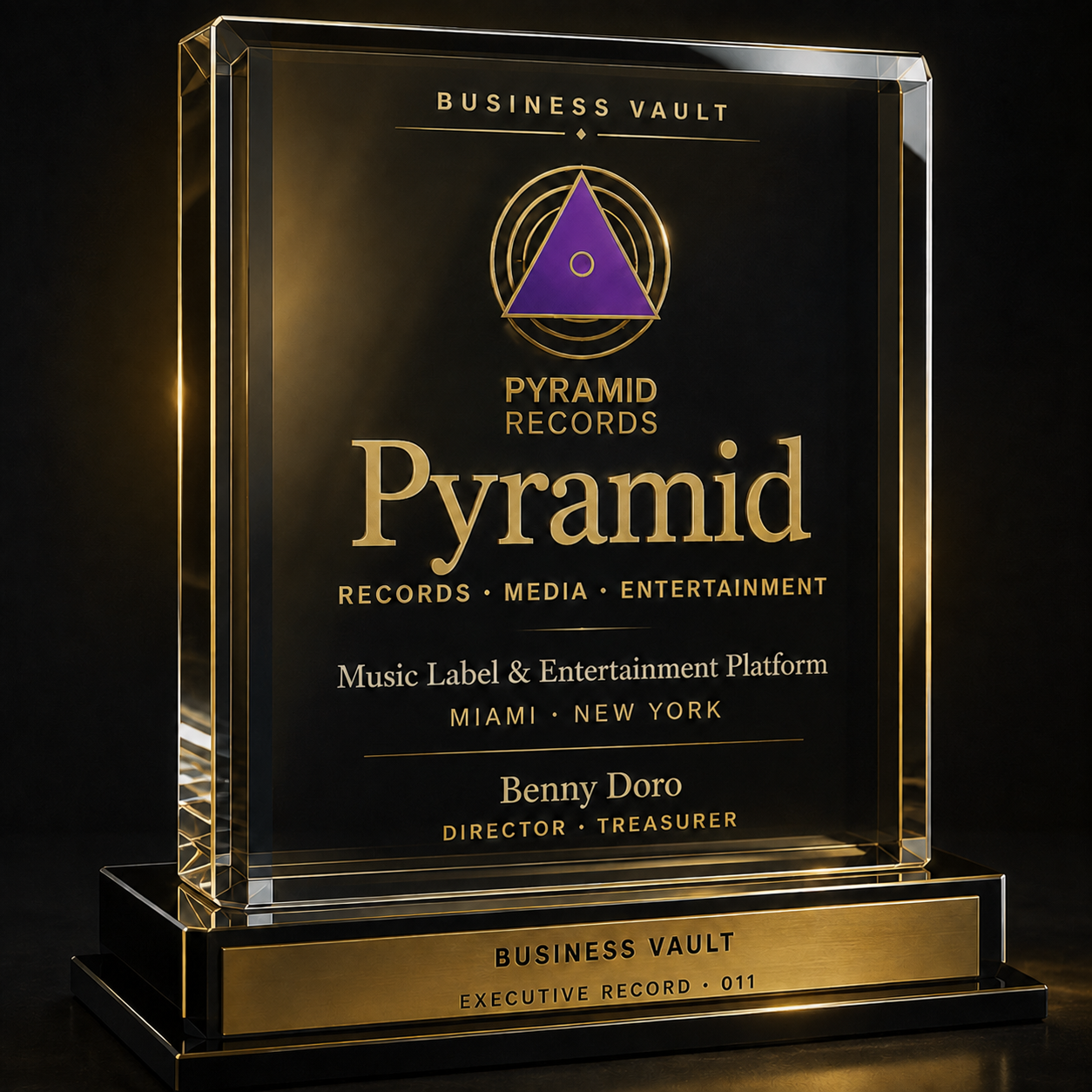 Pyramid Executive Record 011: a warm music-industry Business Vault crystal award. The purple Pyramid triangle is suspended within layered optical crystal above a piano-black base and engraved brushed-gold plate.